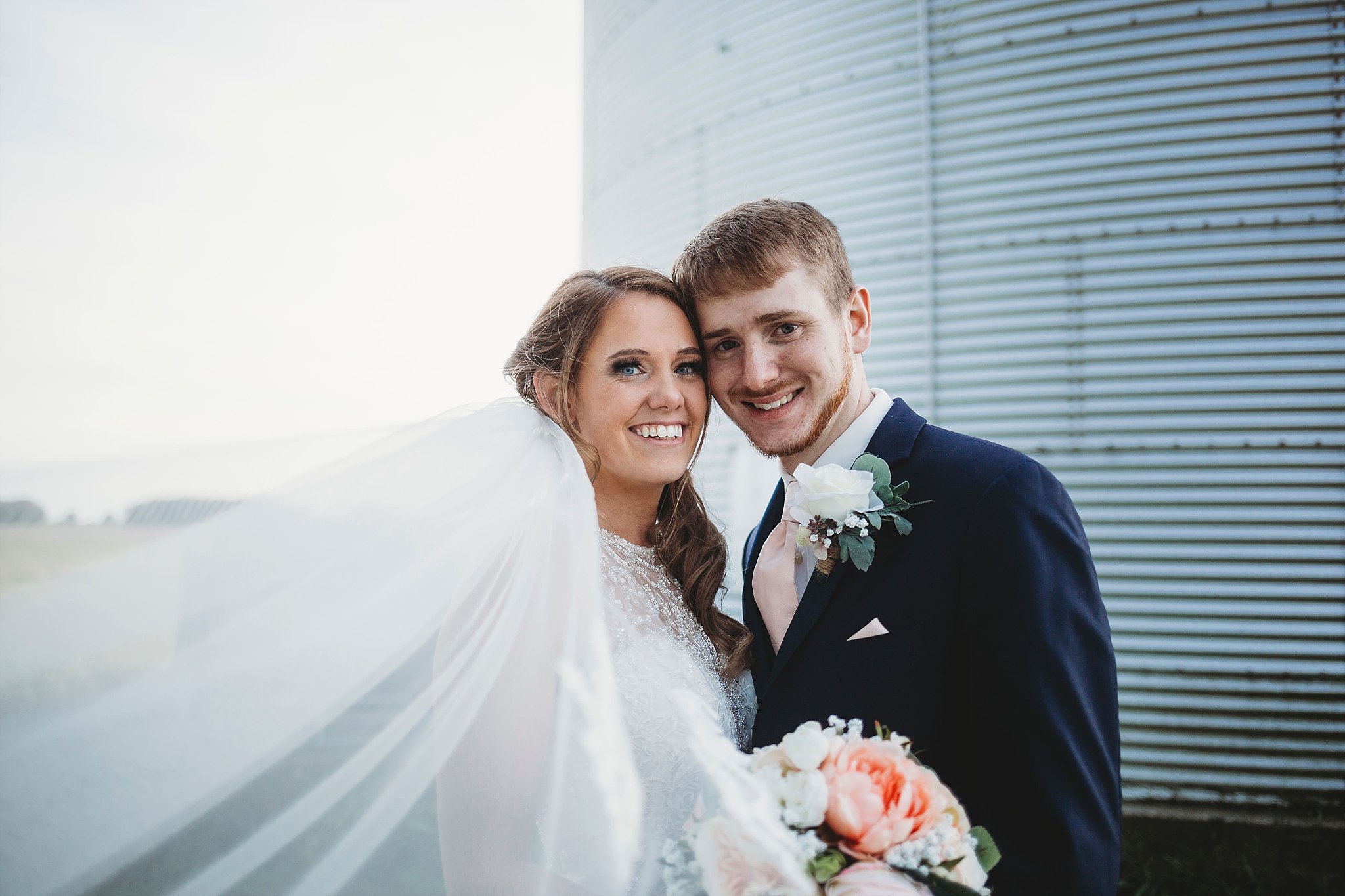 bride and groom smiling at their meadow springs manor wedding in Francesville, Indiana