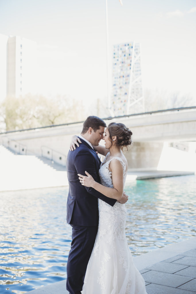 Romantic Places in Indianapolis To Propose- Bride and Groom Hugging at The Indianapolis Canal