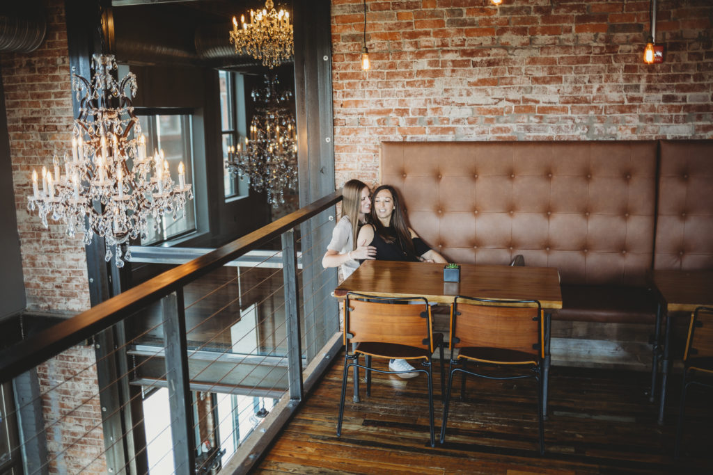 LGBTQ+ Friendly Restaurants in Indiana- Couple enjoying a meal at Taxman Brewing Company in Fortville, Indiana