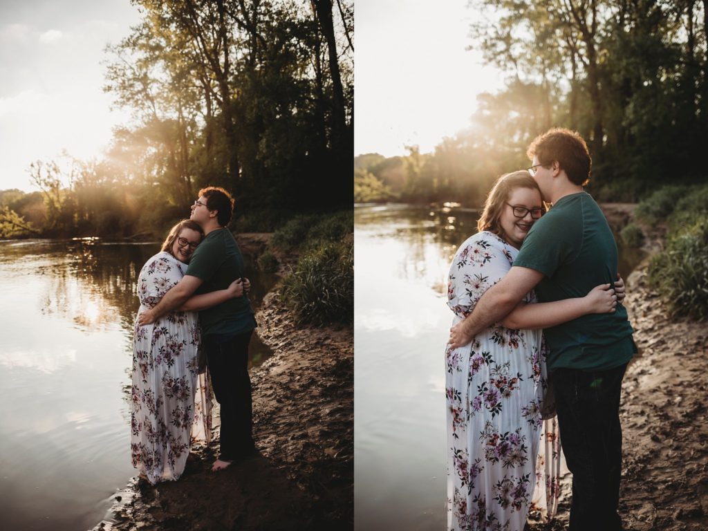 engagement pictures in Lafayette Indiana - man and woman kissing beside the water at romantic engagement photos at Wildcat Creek Park during sunset