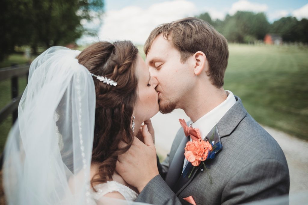husband and wife kissing after their ceremony at their Monticello, Indiana wedding. 