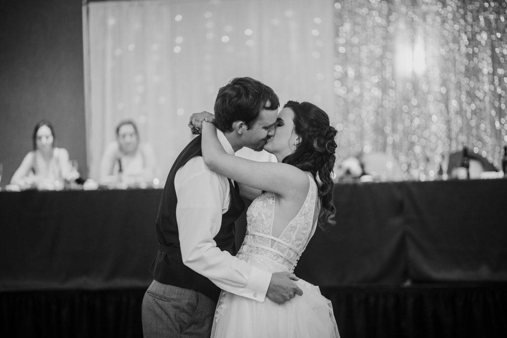 Bride and groom kissing during their first dance at their Monticello, Indiana wedding. 