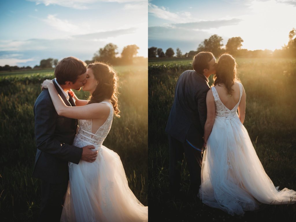 Bride and groom kissing at sunset during their Monticello, Indiana wedding. 