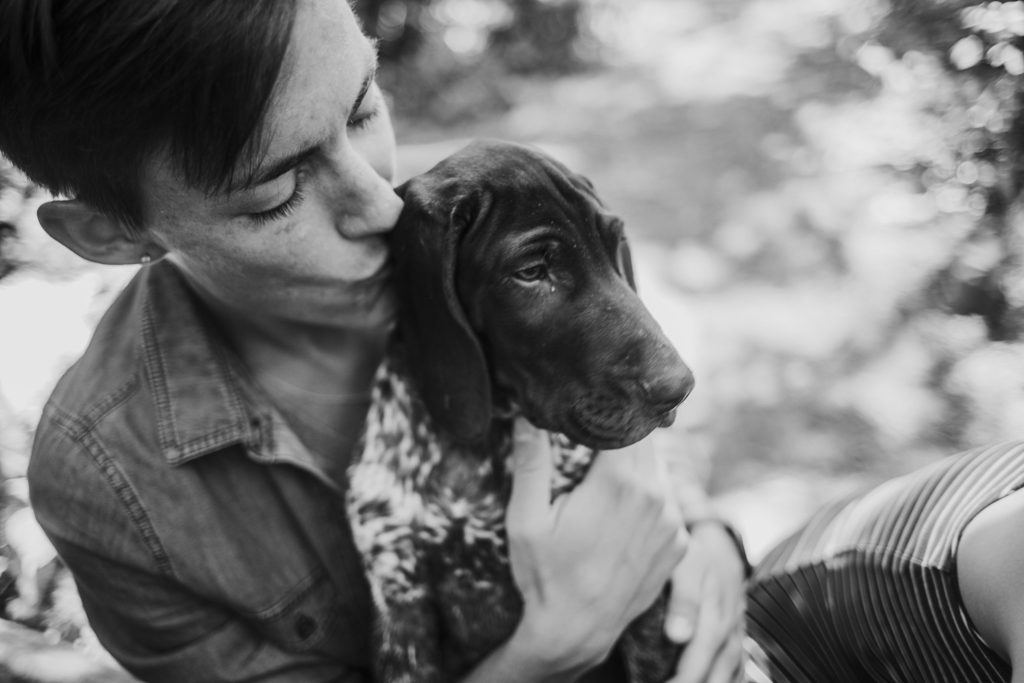 girl kissing on her puppy at their Lafayette, Indiana couples session