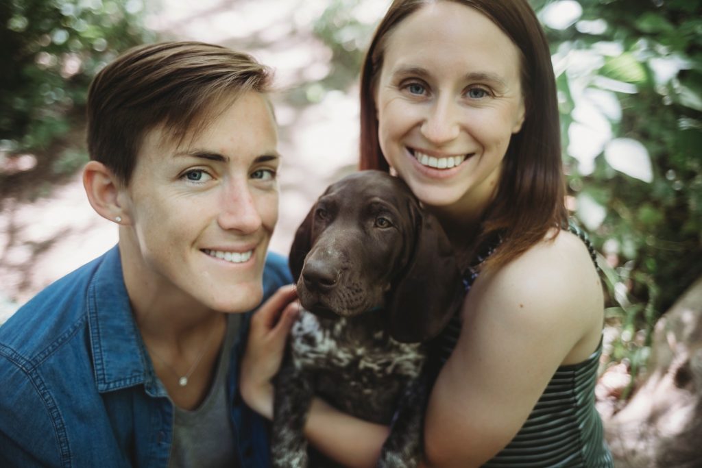 LGBTQ couple snuggling their puppy at their Lafayette, Indiana couples session 