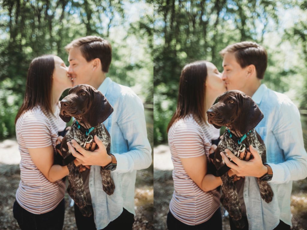 LGBTQ couple kissing while holding their new puppy at their Lafayette, Indiana couples session 