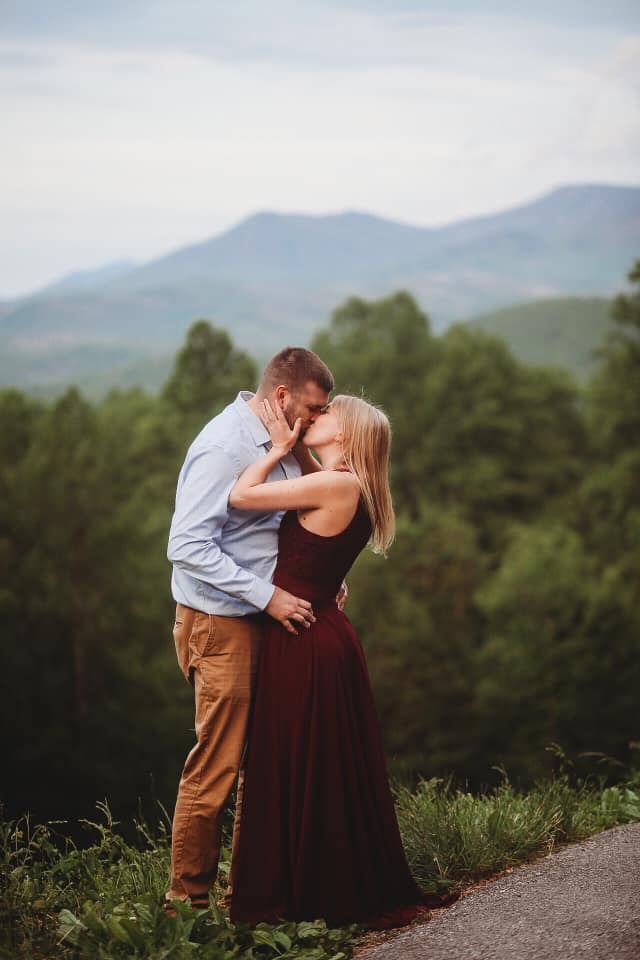 How To Pick A Location For Your Engagement Session// Man and woman kissing amongst the Great Smokey Mountains in Tennessee.