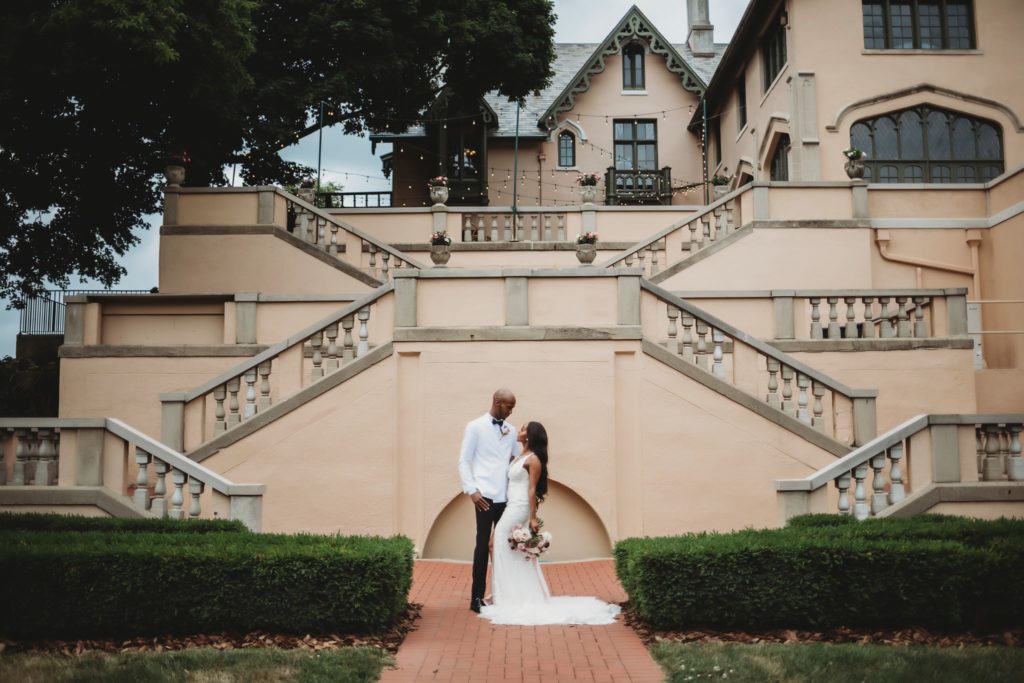 Top Elopement Locations in Central Indiana- man and woman in front of the Fowler Mansion at Lafayette, Indiana wedding