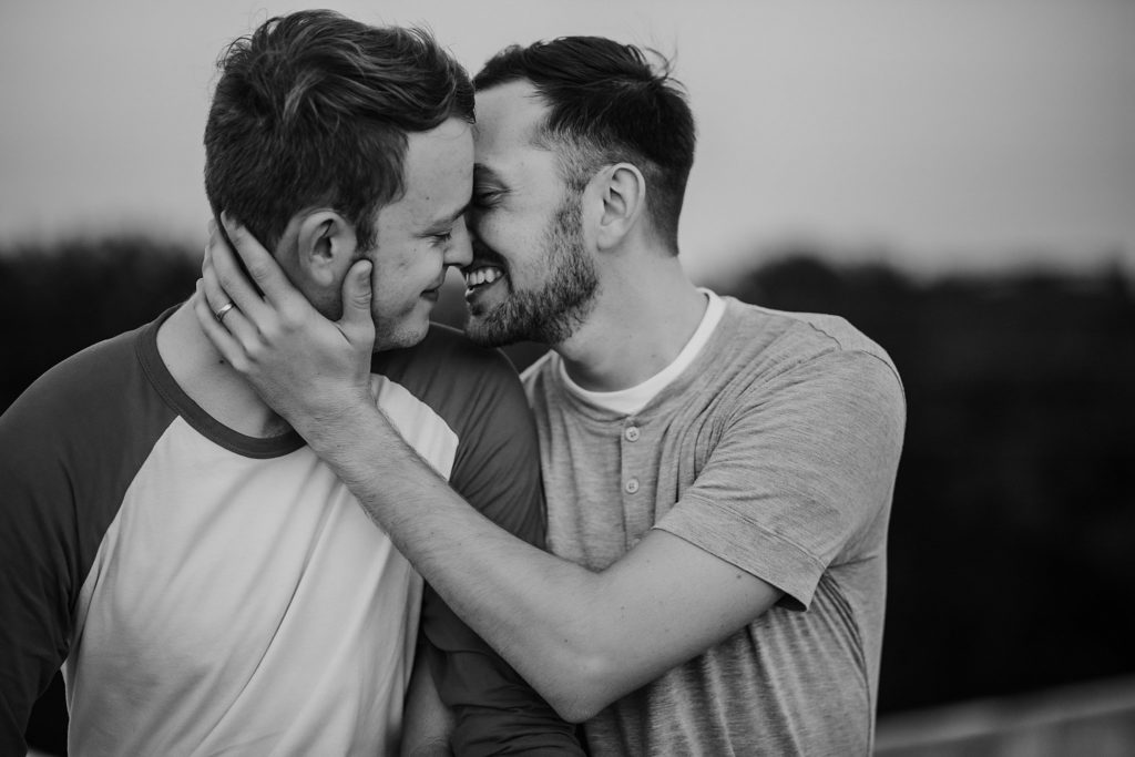 LGBTQ couple leaning in for a kiss during their Indiana LGBTQ engagement session. 