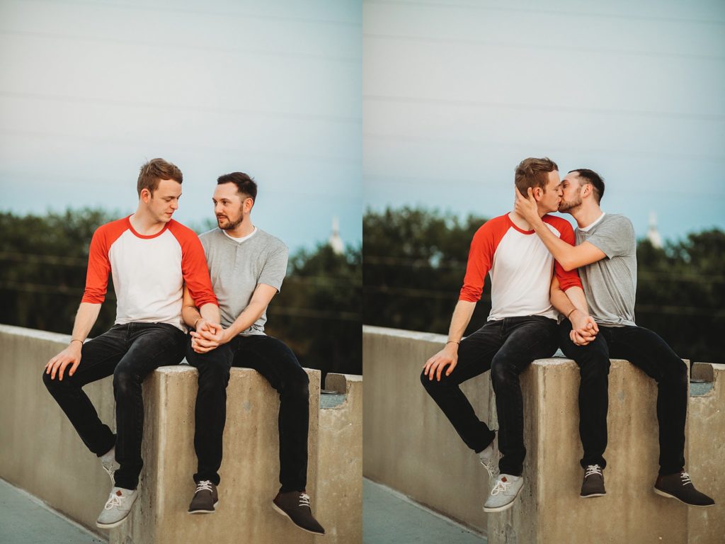 LGBTQ couple sitting while holding hands during their Indiana LGBTQ engagement session. 