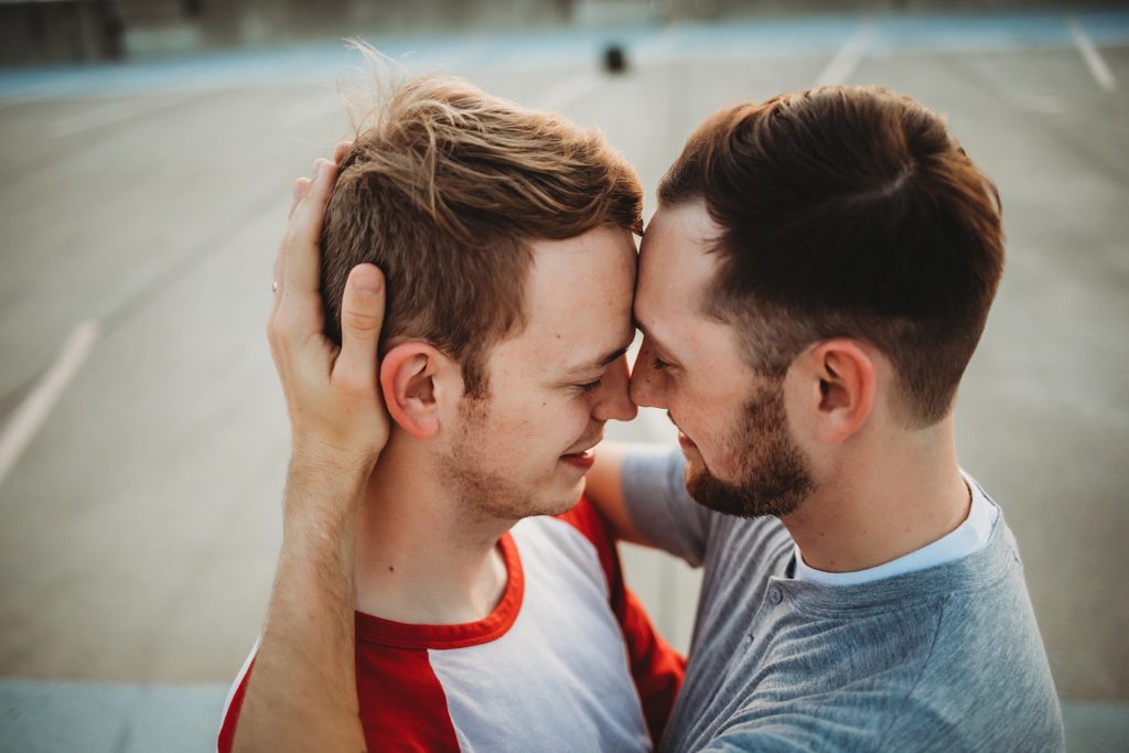 LGBTQ couple touching foreheads during their Indiana LGBTQ engagement session. 
