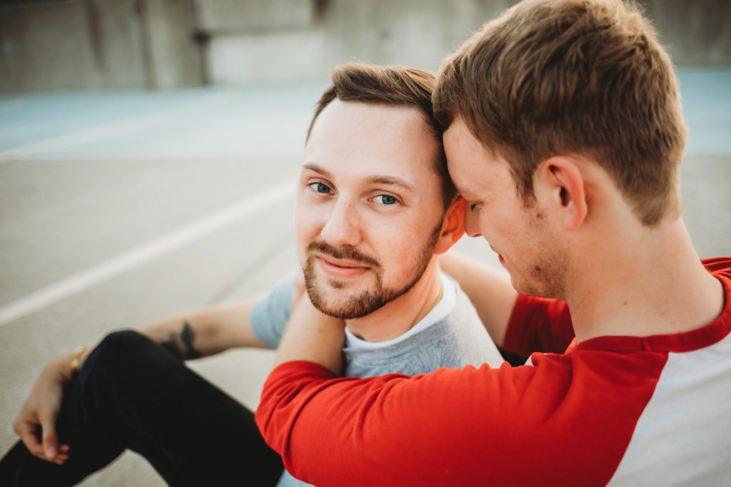man wrapped around man during their Indiana LGBTQ engagement session. 