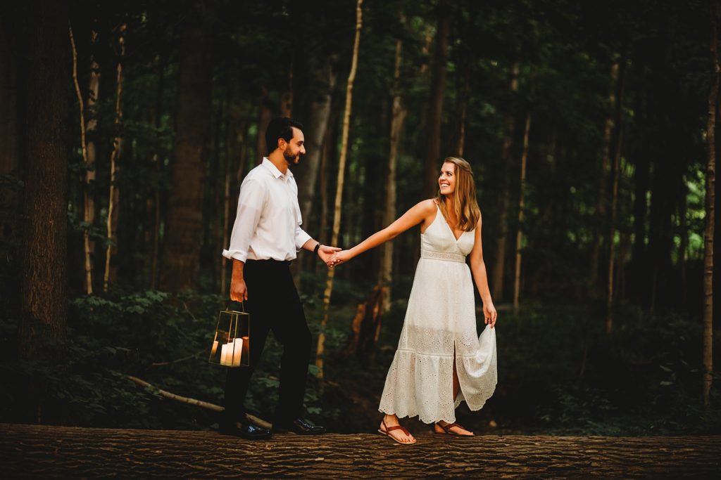 woman leading man while holding hands during their Indianapolis Indiana Anniversary Session