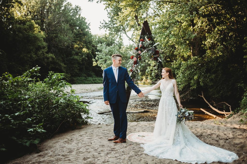 10 Reasons You Should Elope in the Midwest - Couple looking lovingly at each other holding hands at their Indiana elopement 