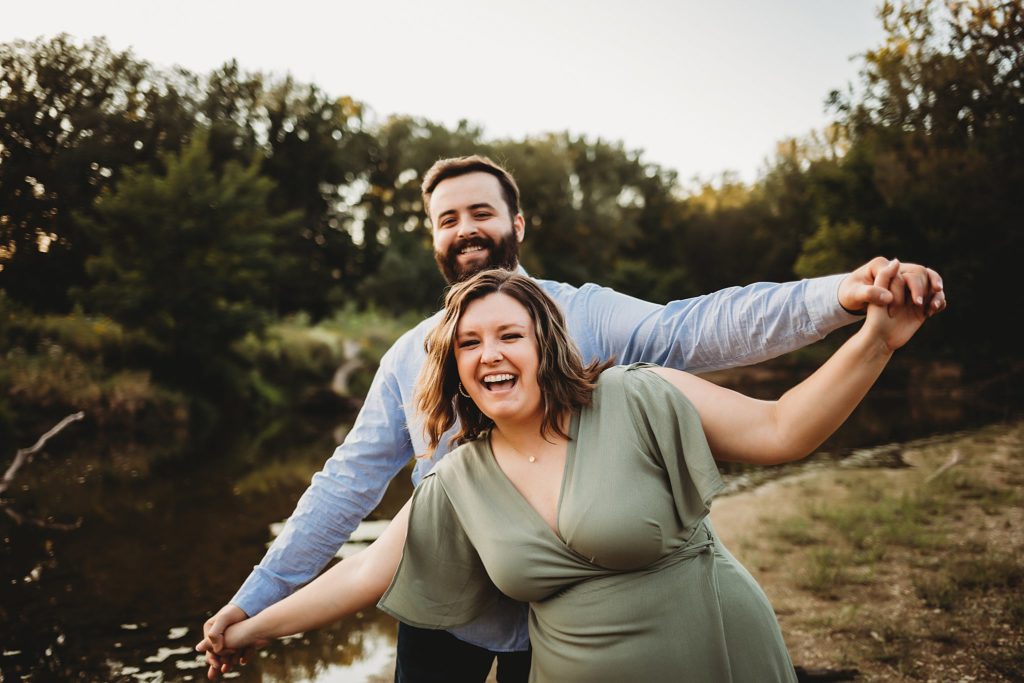 West Lafayette Indiana Couples Session// Evan + Abby - Couple airplane walks together while laughing.