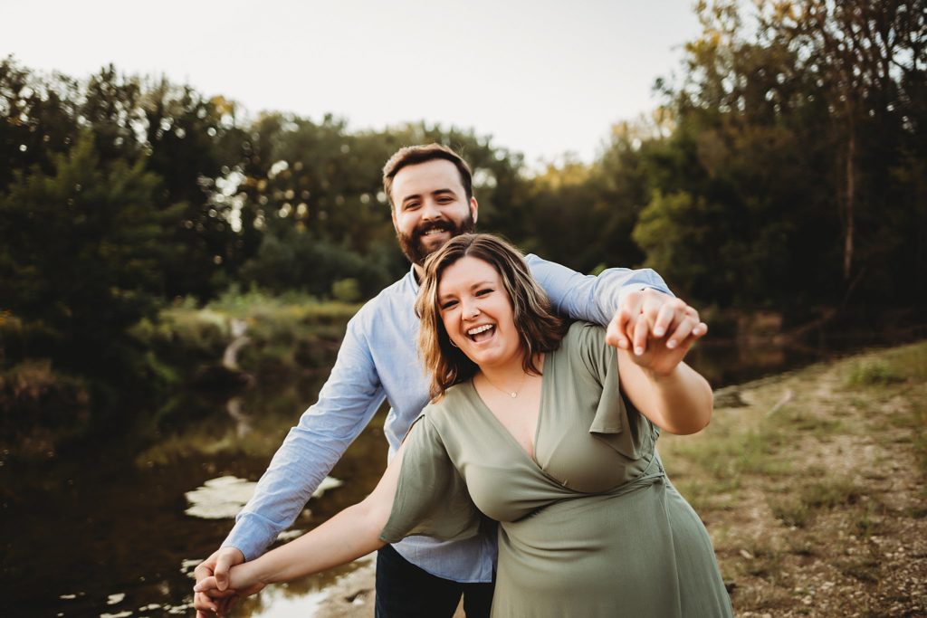 West Lafayette Indiana Couples Session// Evan + Abby - Couple airplane walks together while laughing.