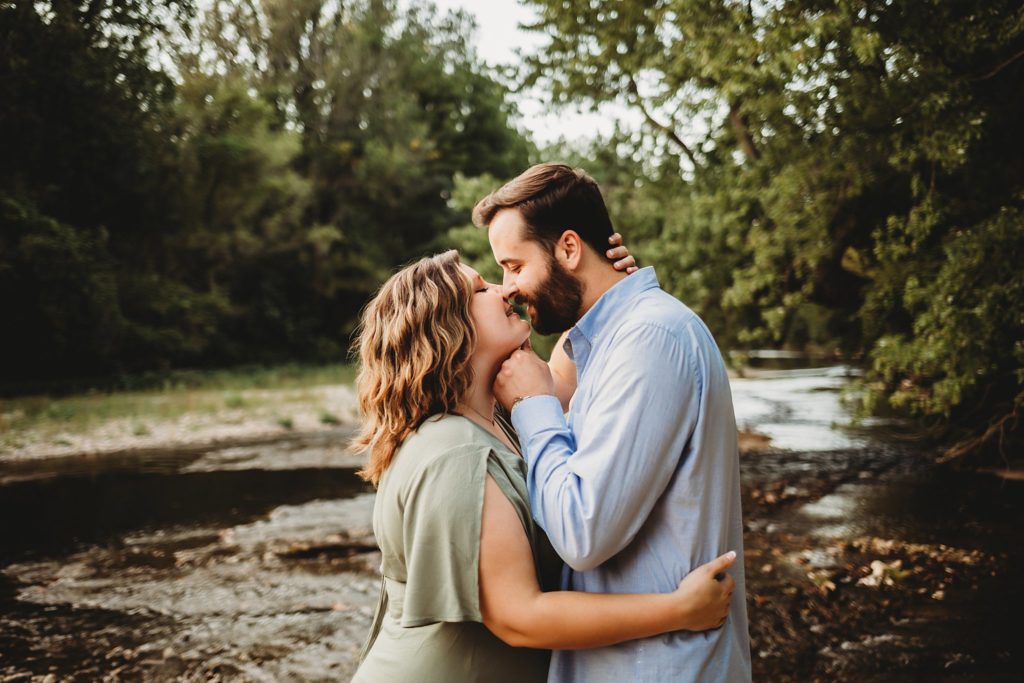 West Lafayette Indiana Couples Session// Evan + Abby - Man rests hand under woman's chin to kiss her. Woman has her arm around man's waist.