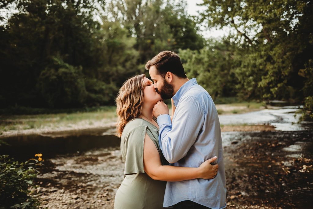 West Lafayette Indiana Couples Session// Evan + Abby - Man rests hand under woman's chin to kiss her. Woman has her arm around man's waist.