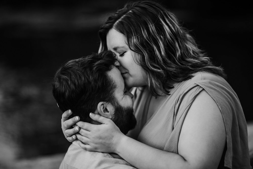 West Lafayette Indiana Couples Session// Evan + Abby - Couple snuggles together, woman gives man a kiss on the forehead.