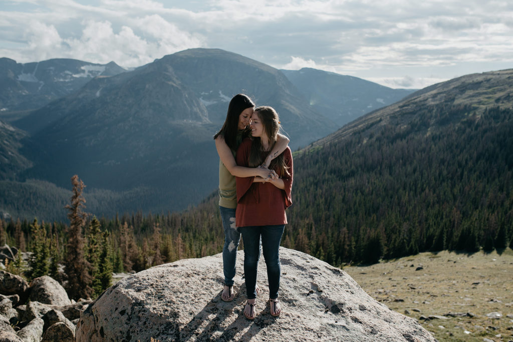 Two woman looking at each other lovingly at Rocky Mountain National Park LGBTQ wedding- Lgbtq business owners
