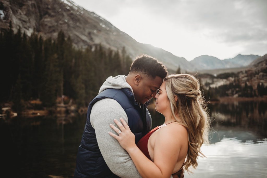 Breckenridge Engagement Session-couple staring at each other in breckenridge colorado