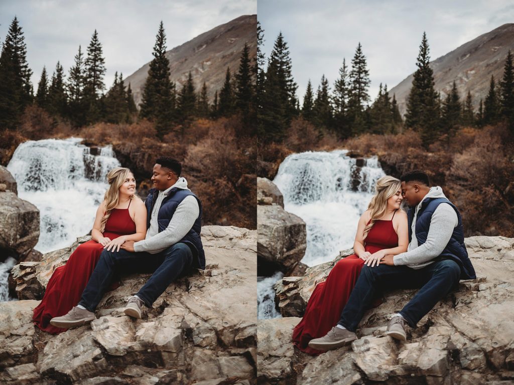 couple posing by waterfall