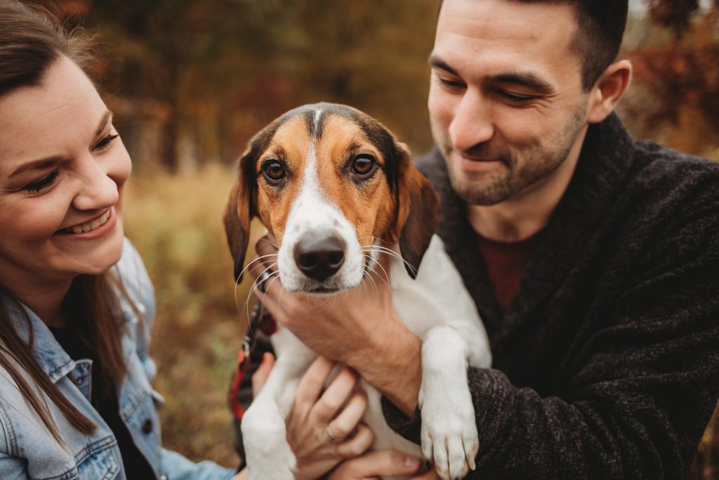 man woman and their dog at their West Lafayette Couples Session