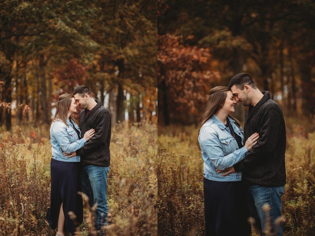 man and woman embrace for engagement pictures at their West Lafayette Couples Session
