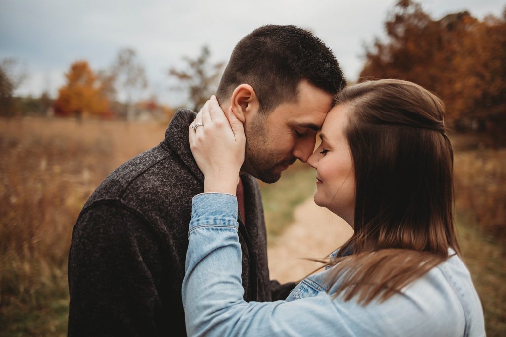 man and woman serious for their engagement pictures 