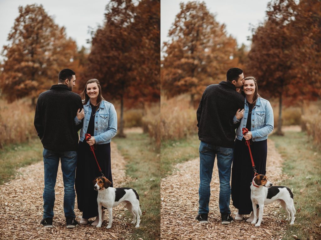 woman hugs mans arm for their engagement pictures
