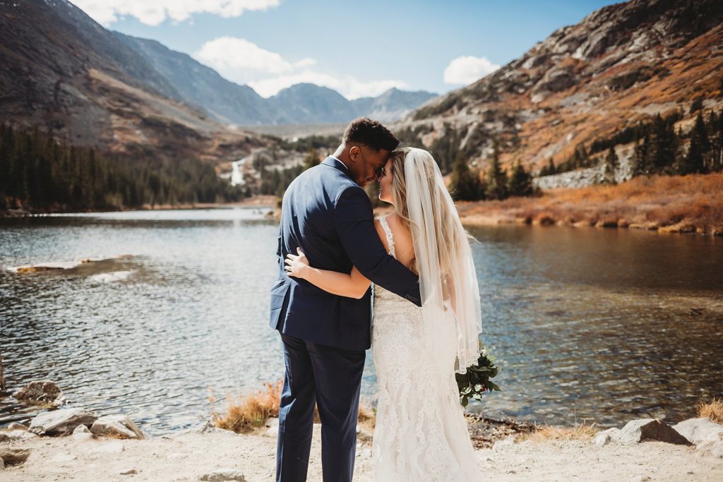 Bride and groom looking into each other's eyes at Blue Lakes in Breckenridge Colorado Elopement 