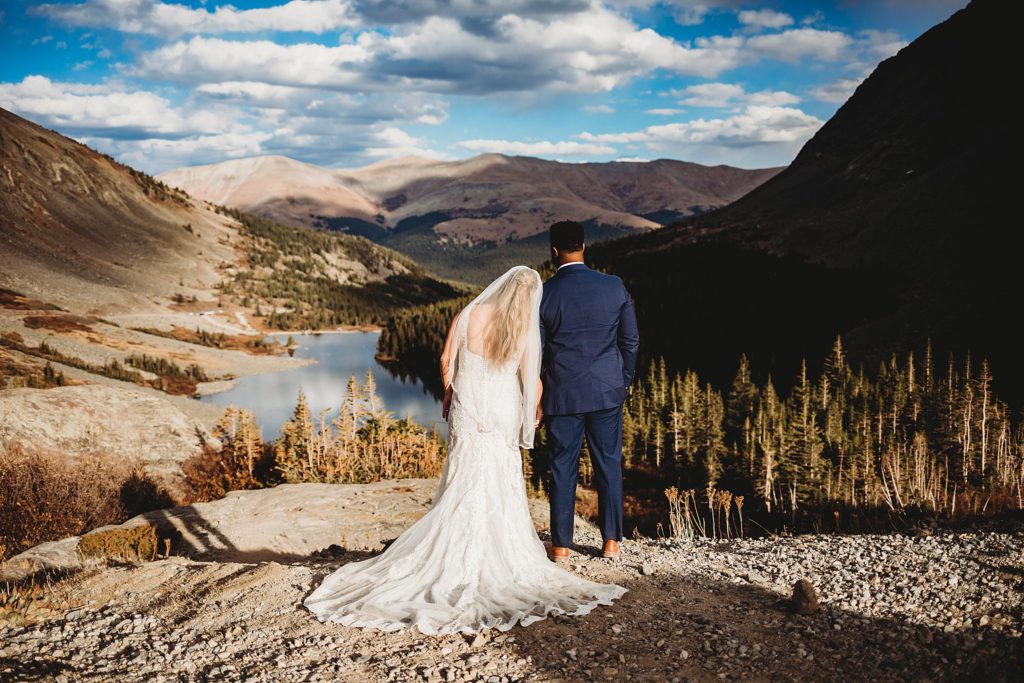 husband and wife looking out over Breckenridge, elopement ideas