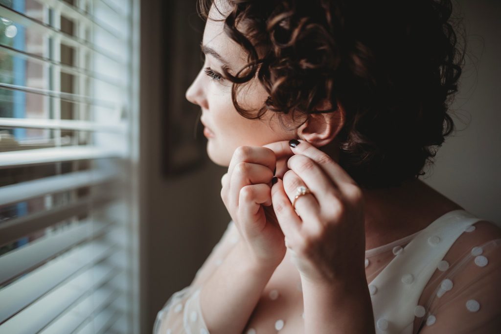 the bride puts her earrings in before her West Lafayette Indiana Elopement