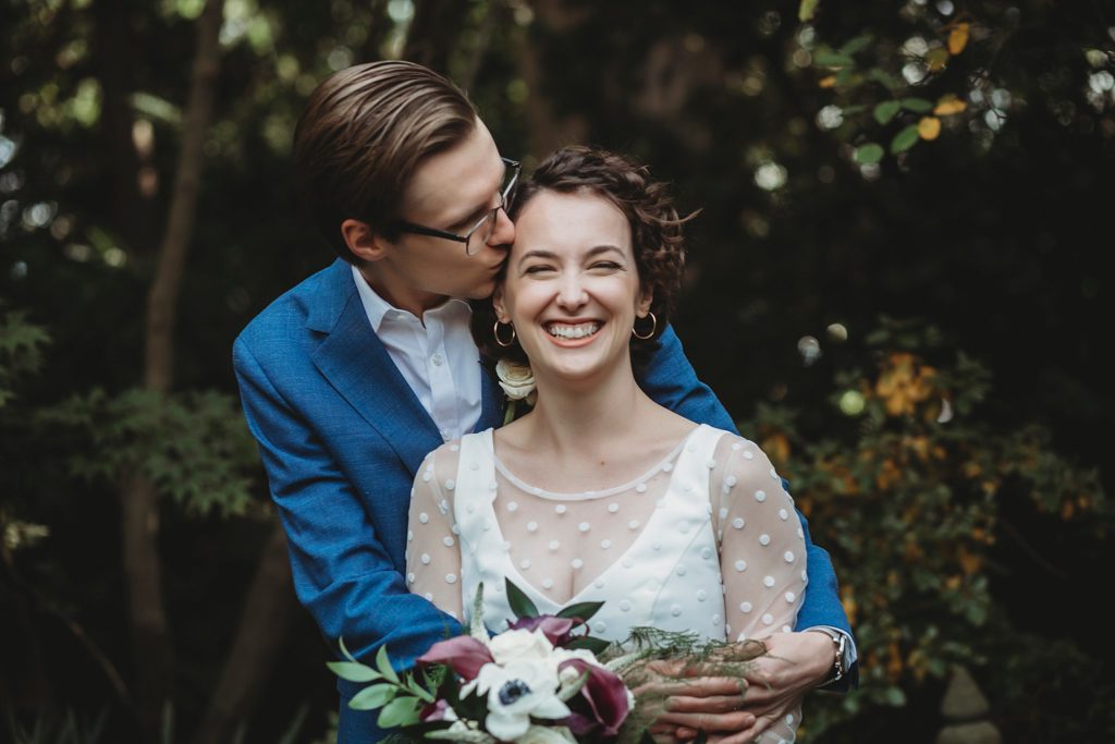 elopement trends for 2021- man kissing woman on the forehead at their wedding in west lafayette, Indiana wedding