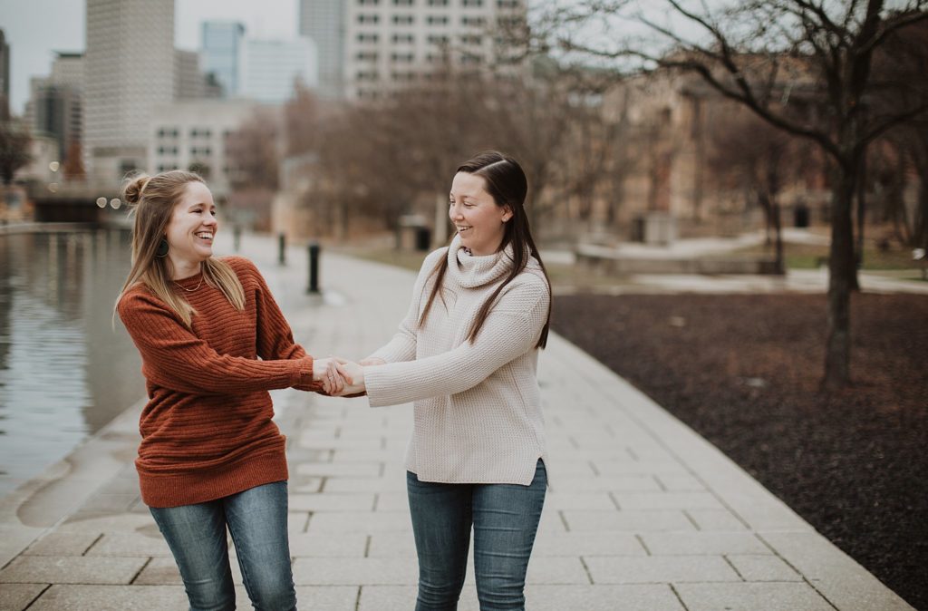 lgbt photographers- two wives holding hands in downtown indianapolis indiana couples session. 