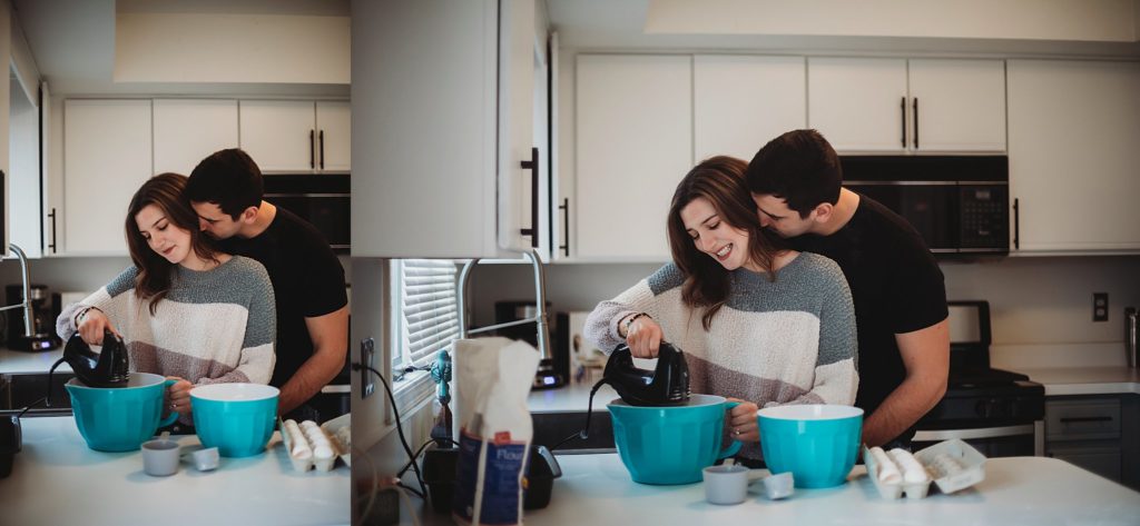 Man holding around woman's waist and nuzzling in her neck while she is mixing flour in a bowl at their Crown Point Indiana Engagement Session