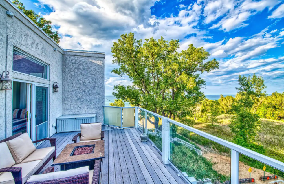 The best Indiana Airbnb overlooking Miller Beach, fit with a fireplace and an array of sitting. 