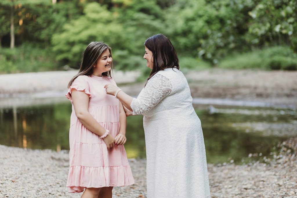 Indianapolis Indiana Elopement- mother helping daughter get ready for their wedding at their Indianapolis, Indiana Elopement