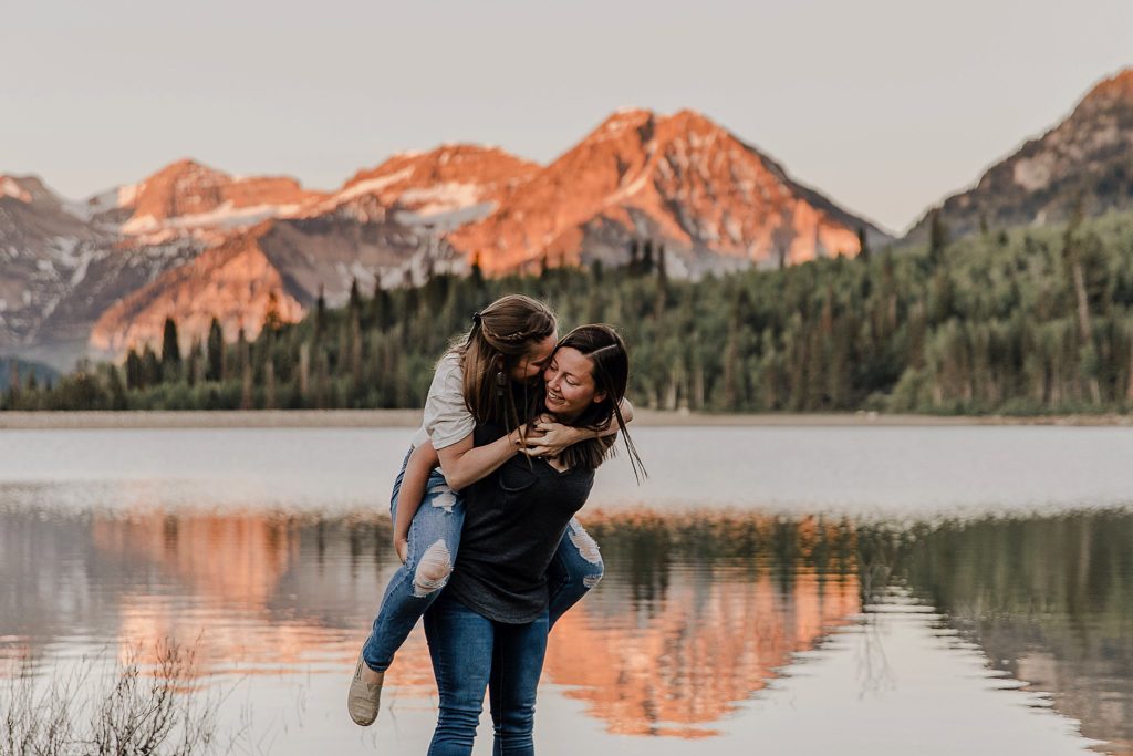 two LGBTQ women holding onto one another at American Fork Canyon in Utah 