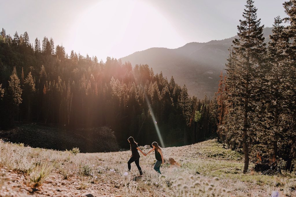 the best places to elope in utah// lgbtq couple climbing a mountain in utah 