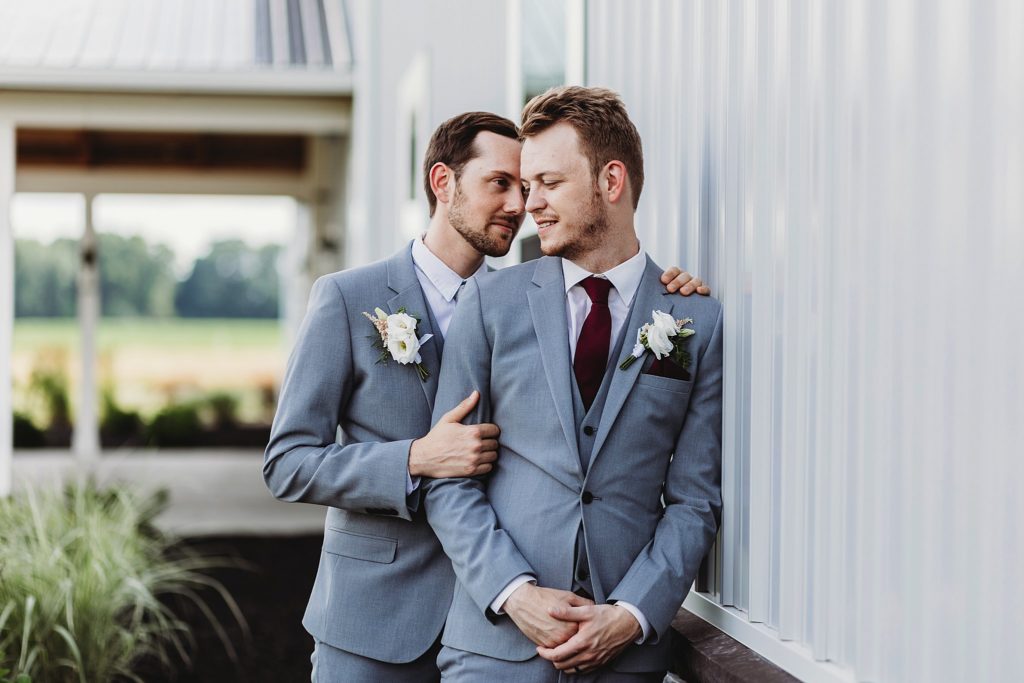 man and man looking into one anothers eyes at their New Journey Farms Wedding in Lafayette, Indiana