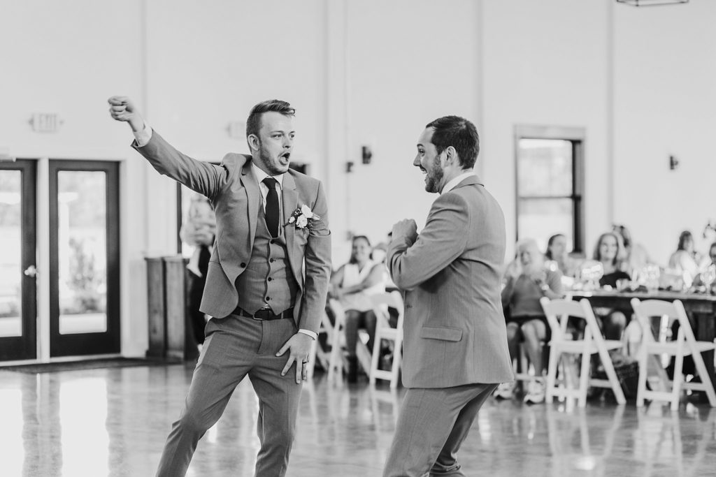 man and man dancing at their LGBTQ wedding