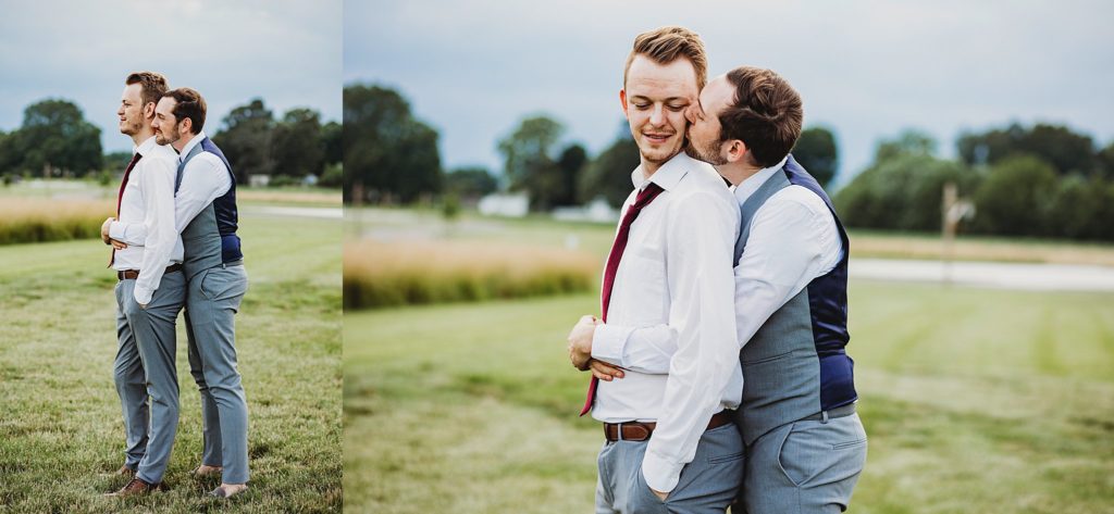 man and man holding onto one another at their LGBTQ wedding
