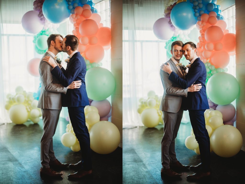 Two men kissing at an indianapolis wedding venue called the ivory foundry 