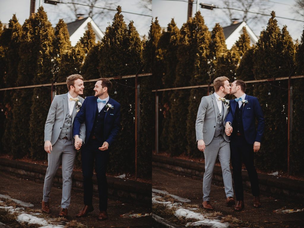 Two men holding hands and walking at an Indianapolis Wedding Venue called the ivory foundry