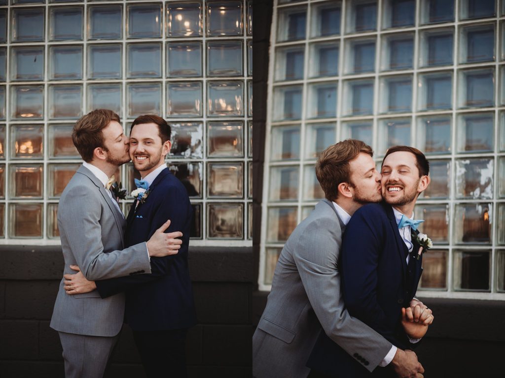 Two men hugging on one another at an Indianapolis Wedding Venue called the ivory foundry