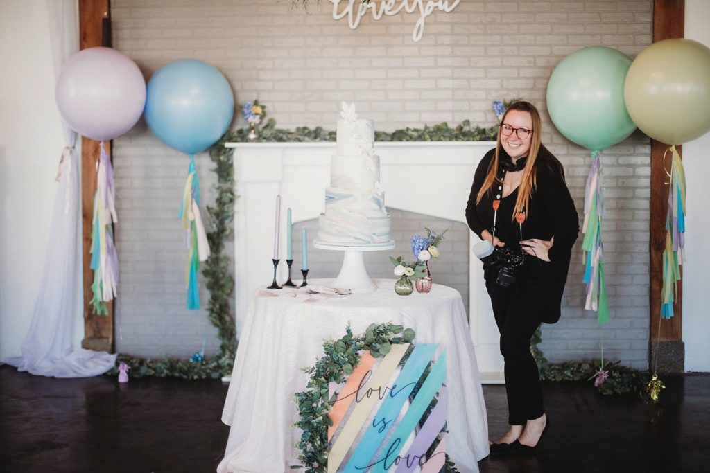 Jasmine Norris Photography standing next to a cake created by Classic Cakes of Carmel, Indiana
