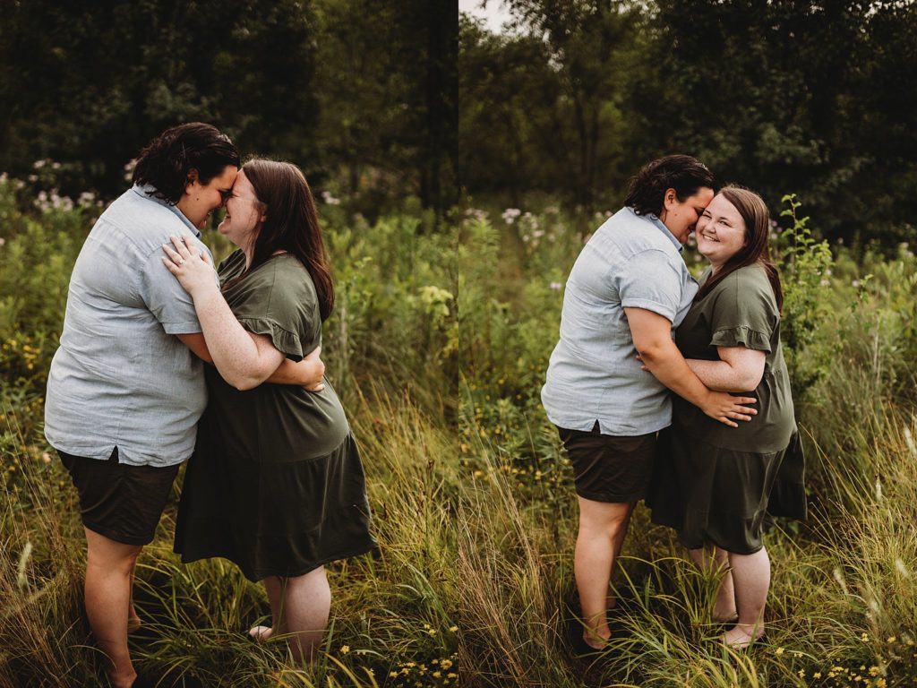woman kissing womans check at a park at their Indianapolis LGBTQ Engagement Session