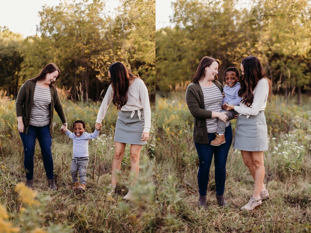 Same sex couple hold their child during their chicago family session 