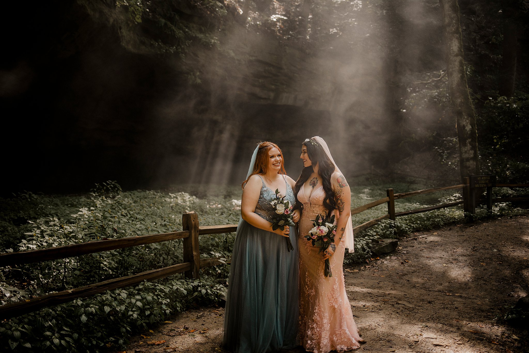 lgbtq elopement couple looking at each other while they are at turkey run in indiana